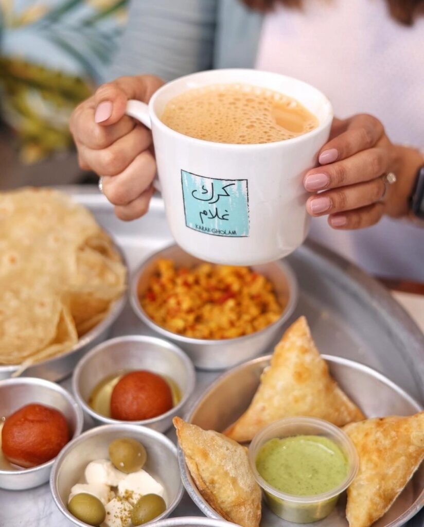 Karak Gholam tea and menu plate