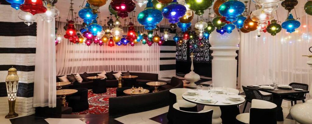 walima restaurant dining area with colorful ceiling with lights