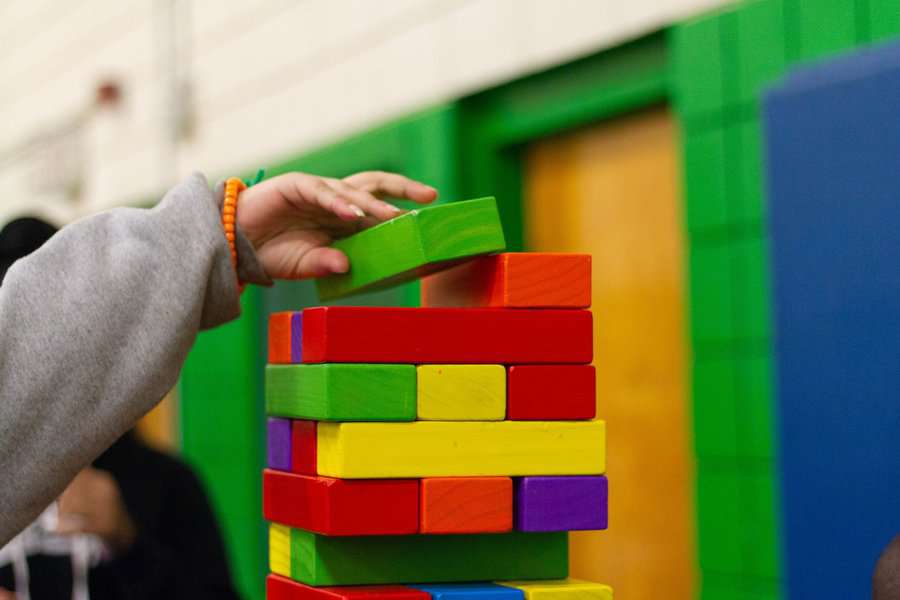 a little child playing building blocks