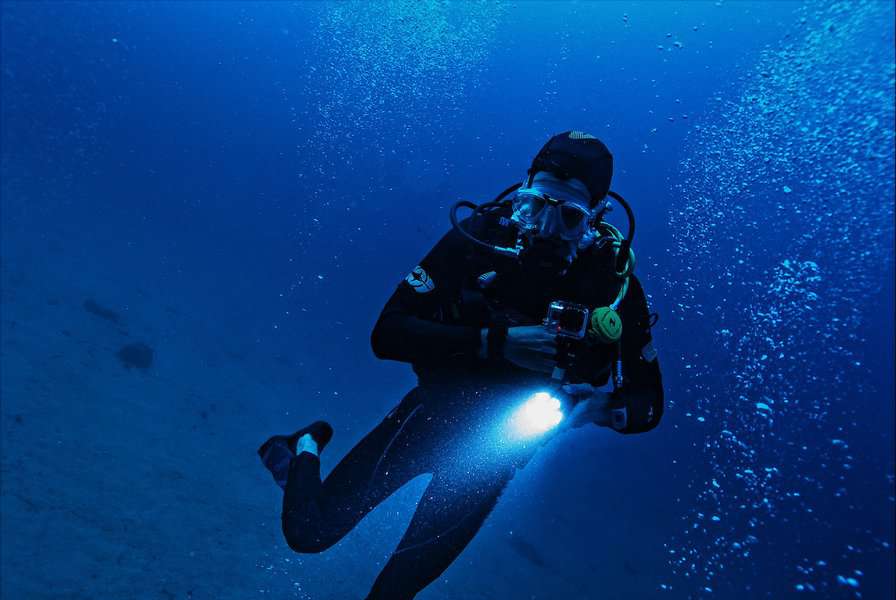 A man scuba diving in the ocean