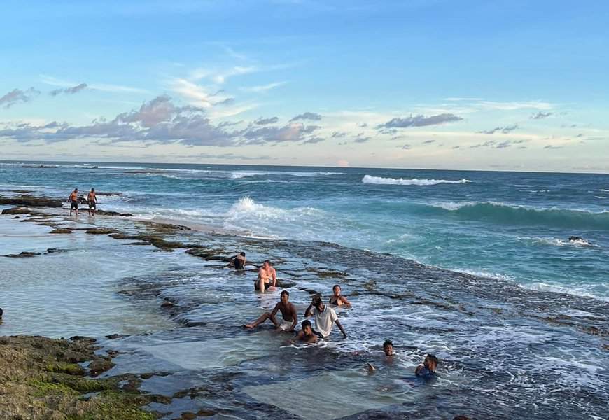 people taking bath in thalpe beach