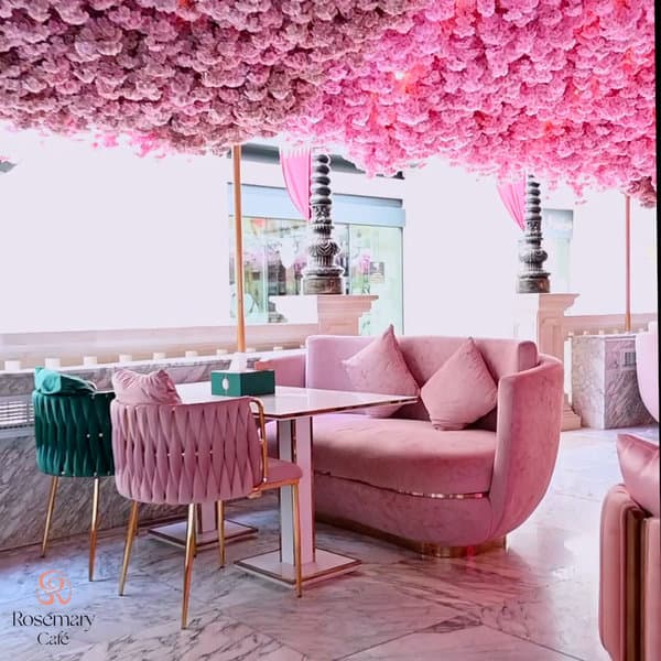 beautiful pink flowers hanging above the dining area of Rosemary café