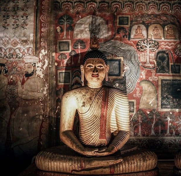 A beautiful Image of Buddha posing in a sitting position inside Dambulla cave temple