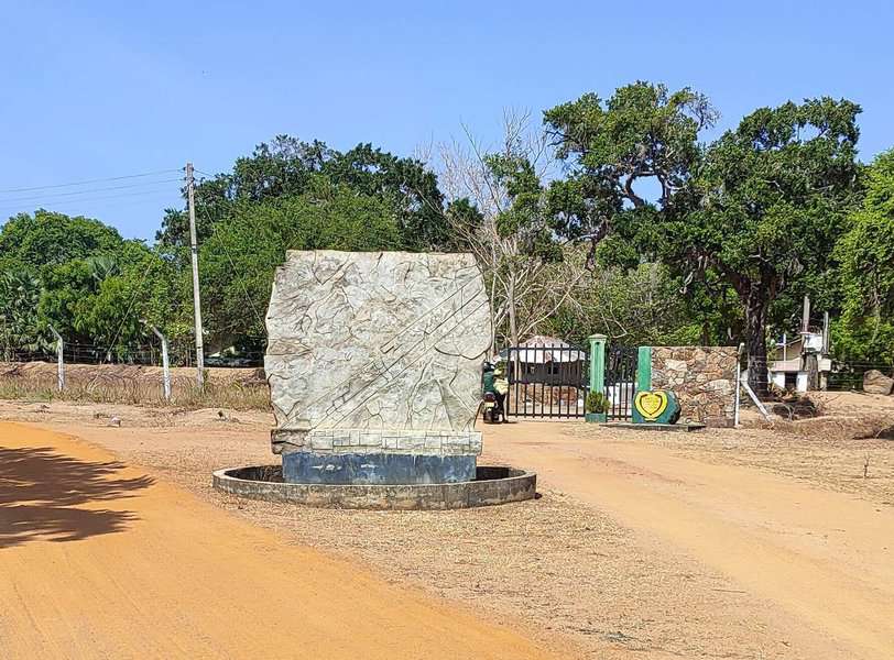 The army camp entrance gate and the gravel road next to it