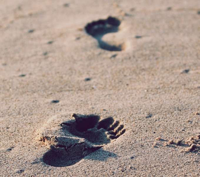 Foot steps on the beach