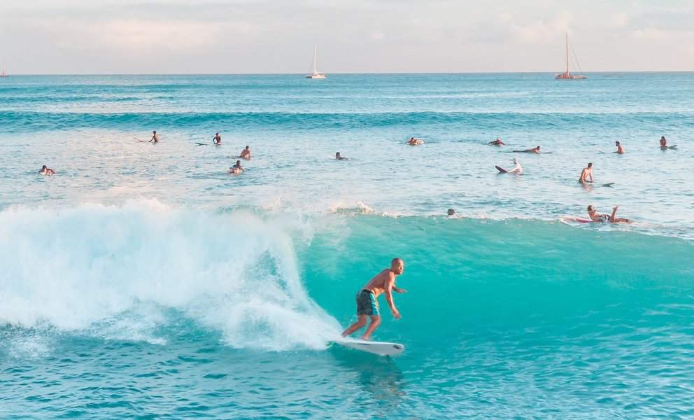 A man enjoying surfing