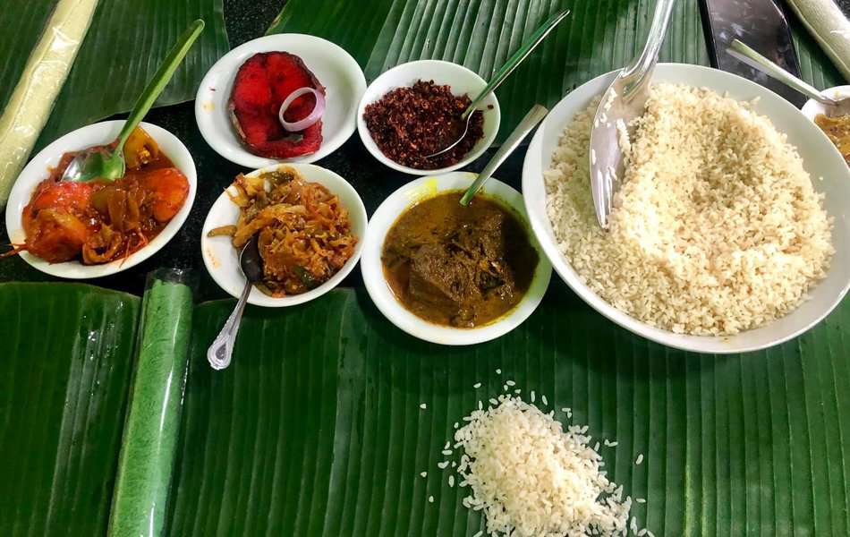 Rice and curry in banana leaf