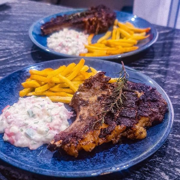 Beaf steak and French fries at Licensed to Grill