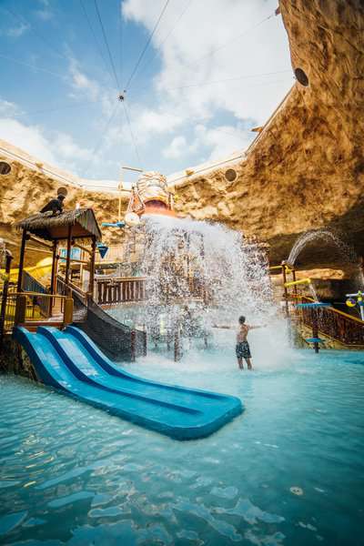 A man standing in the desert falls water park in Qatar