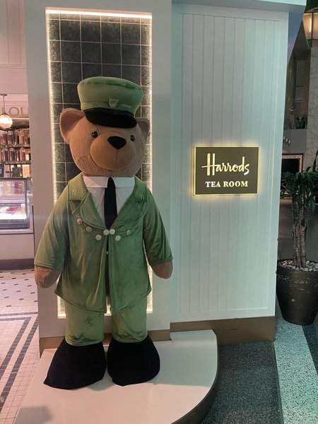 Harrods tea room model bear standing near entrance view